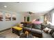 Open-concept living room featuring modern decor, a ceiling fan and lots of natural light at 150 Sandy Ridge Trl, Fayetteville, GA 30214