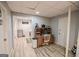 Well-lit office area with a desk, a computer, and access to a laundry room at 150 Sandy Ridge Trl, Fayetteville, GA 30214