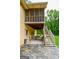 Stone patio featuring stairs to the porch and ample space for seating, perfect for outdoor entertaining at 150 Sandy Ridge Trl, Fayetteville, GA 30214