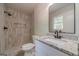 Bathroom featuring walk-in shower, granite countertop, and square undermount sink at 3404 Broxton Mill Way, Snellville, GA 30039