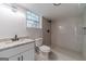 Modern bathroom features granite countertop vanity and tiled shower at 3404 Broxton Mill Way, Snellville, GA 30039