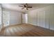 Bedroom featuring neutral carpeting, ceiling fan, and ensuite bathroom access at 3404 Broxton Mill Way, Snellville, GA 30039