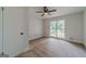Cozy bedroom with carpet flooring, a ceiling fan, and natural light from a double window at 3404 Broxton Mill Way, Snellville, GA 30039