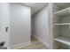 Hallway with wood-look floors leading to storage and laundry connections at 3404 Broxton Mill Way, Snellville, GA 30039