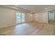 Large living room with gleaming hardwood floors and lots of natural light from the windows at 3404 Broxton Mill Way, Snellville, GA 30039