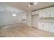 Spacious, open-concept living and kitchen area with modern finishes and hardwood flooring throughout at 3404 Broxton Mill Way, Snellville, GA 30039