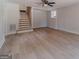 Basement living room with stairs and wood-look flooring at 3404 Broxton Mill Way, Snellville, GA 30039