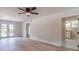 Living room with wood-look flooring and French doors to the backyard at 3404 Broxton Mill Way, Snellville, GA 30039