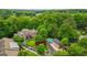 Aerial view of a beautiful community, showcasing the manicured landscaping, grand home, and refreshing pool at 1858 Preserve Way, Atlanta, GA 30341