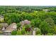 Bird's eye view of the grand home nestled in a lush, green community with a pool at 1858 Preserve Way, Atlanta, GA 30341
