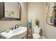 Bathroom featuring pedestal sink, framed mirror, decorative ladder, and painted walls at 1858 Preserve Way, Atlanta, GA 30341