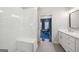 Bathroom featuring a glass shower and modern sink with view of a bedroom in background at 1858 Preserve Way, Atlanta, GA 30341