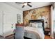 Comfortable bedroom with a bed, world map wall decor, and a ceiling fan for a cozy and stylish living space at 1858 Preserve Way, Atlanta, GA 30341