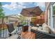 Relaxing deck area features outdoor seating and an umbrella for shade at 1858 Preserve Way, Atlanta, GA 30341