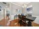 Dining room boasts hardwood floors, a decorative chandelier, and a neutral paint palette at 1858 Preserve Way, Atlanta, GA 30341