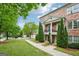 Charming brick townhome with a balcony, set on a well-maintained lawn with lush greenery at 1858 Preserve Way, Atlanta, GA 30341