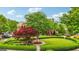 Well-manicured front yard features lush landscaping and decorative trees and bushes at 1858 Preserve Way, Atlanta, GA 30341