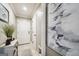 Hallway with neutral paint and stylish decor leading to various rooms, providing a seamless transition throughout the home at 1858 Preserve Way, Atlanta, GA 30341