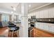 Modern kitchen with a breakfast bar, stainless appliances, and a stylish mosaic backsplash at 1858 Preserve Way, Atlanta, GA 30341