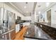 Well-equipped kitchen with stainless steel appliances, stylish backsplash, and granite countertops at 1858 Preserve Way, Atlanta, GA 30341