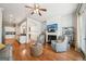 Open-concept living area with hardwood floors, fireplace, and a view into the modern kitchen at 1858 Preserve Way, Atlanta, GA 30341