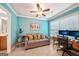 Living room with sofa, desk, and a view into an adjacent bathroom, showcasing its comfortable and inviting ambiance at 1858 Preserve Way, Atlanta, GA 30341