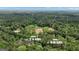 Aerial view of two parcels: a 10-acre lot and a 12.10-acre lot, both surrounded by lush forest at 6290 Cascade Palmetto Hwy, Fairburn, GA 30213