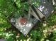 Unique aerial view of treehouse showing the deck with furniture and an outdoor hot tub surrounded by lush trees at 6290 Cascade Palmetto Hwy, Fairburn, GA 30213