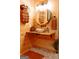 Modern bathroom with a vessel sink, wood countertop, and round mirror at 6290 Cascade Palmetto Hwy, Fairburn, GA 30213