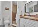 Bathroom with a walk-in shower, white vanity with black hardware, and stylish decor at 6290 Cascade Palmetto Hwy, Fairburn, GA 30213