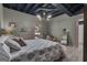 Bedroom with light wood floors, modern lighting, neutral colors, and a tranquil view from the exit door at 6290 Cascade Palmetto Hwy, Fairburn, GA 30213