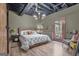 Bedroom with light wood floors, modern light fixture, neutral colors, and an exit door at 6290 Cascade Palmetto Hwy, Fairburn, GA 30213