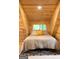 Cozy bedroom with high ceilings, comfortable bed, and geometric rug at 6290 Cascade Palmetto Hwy, Fairburn, GA 30213