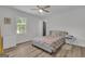 Comfortable bedroom featuring a bed, dresser, and ample natural light from a window at 6290 Cascade Palmetto Hwy, Fairburn, GA 30213
