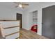 Cozy bedroom featuring modern gray doors and a built-in storage shelf at 6290 Cascade Palmetto Hwy, Fairburn, GA 30213