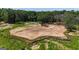 Expansive cleared lot with black drainage border, ready for construction and surrounded by mature trees at 6290 Cascade Palmetto Hwy, Fairburn, GA 30213