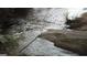 Serene creek view with rocks and vegetation, offering a natural escape at 6290 Cascade Palmetto Hwy, Fairburn, GA 30213