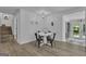 Cozy dining area with modern table and chairs, natural lighting, and access to outdoor space at 6290 Cascade Palmetto Hwy, Fairburn, GA 30213