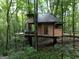 Custom treehouse featuring an upper deck with seating, perfect for outdoor relaxation and enjoying nature at 6290 Cascade Palmetto Hwy, Fairburn, GA 30213