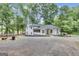 Charming two-story farmhouse-style home with white siding and black trim at 6290 Cascade Palmetto Hwy, Fairburn, GA 30213