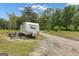 Exterior view of the Wildwood RV with a concrete patio and outdoor furniture under a sunny sky at 6290 Cascade Palmetto Hwy, Fairburn, GA 30213