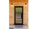 Close-up of a modern front door with glass panels, wood trim, and stylish lighting fixtures at 6290 Cascade Palmetto Hwy, Fairburn, GA 30213