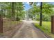 Secluded home featuring mature landscaping and a long driveway at 6290 Cascade Palmetto Hwy, Fairburn, GA 30213
