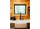 Farmhouse sink with modern faucet under a window with wood trim at 6290 Cascade Palmetto Hwy, Fairburn, GA 30213