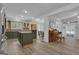 Open kitchen with green cabinets, wooden countertops, island cooktop, and stainless steel appliances at 6290 Cascade Palmetto Hwy, Fairburn, GA 30213