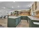 Charming kitchen featuring a central island, dark green cabinets, stainless appliances and wood accents at 6290 Cascade Palmetto Hwy, Fairburn, GA 30213