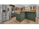A well-appointed kitchen includes stainless steel appliances, stylish cabinets, and spacious countertop at 6290 Cascade Palmetto Hwy, Fairburn, GA 30213
