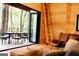Inviting living room with a sliding door to the outdoor deck with table at 6290 Cascade Palmetto Hwy, Fairburn, GA 30213