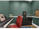 The office has an upright piano, a black chest of drawers, and a patterned rug at 6290 Cascade Palmetto Hwy, Fairburn, GA 30213