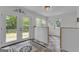 Bright sunroom with double doors, natural light, decorative rug, and access to backyard at 6290 Cascade Palmetto Hwy, Fairburn, GA 30213